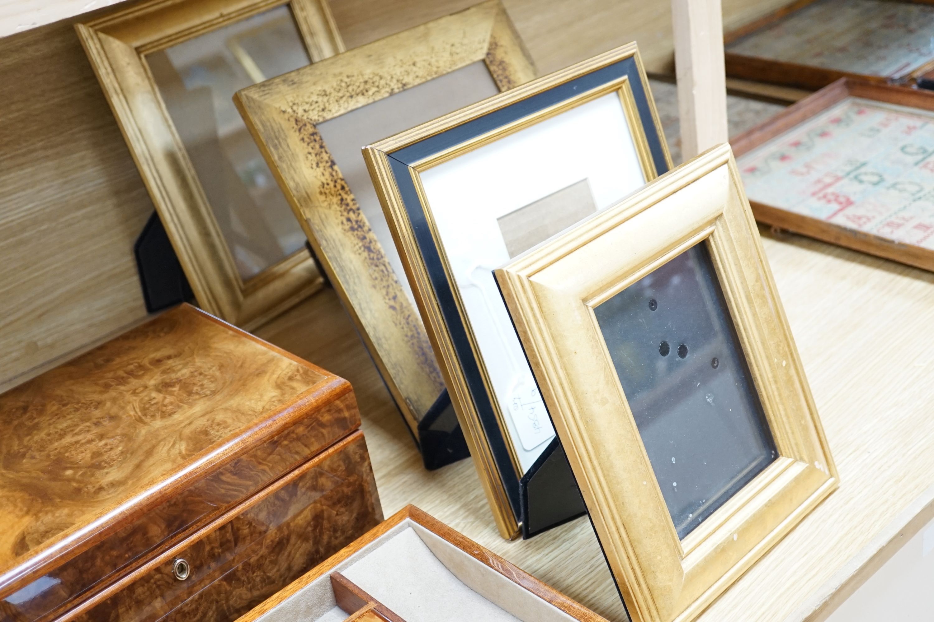 A burr walnut jewellery box, collection of gilt photo frames and a pair of table lamps